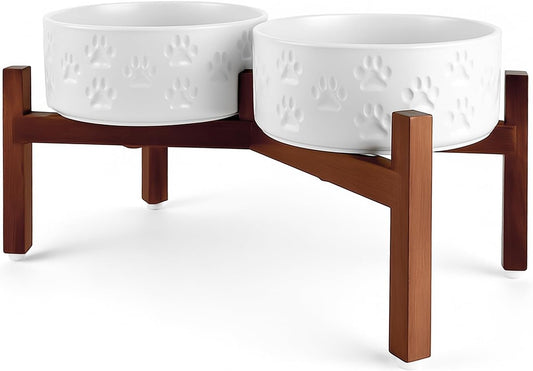 SPUNKYJUNKY Ceramic Elevated Dog Bowl Set with Acacia Wood Stand for Food and Water for Medium Dogs (42.27 OZ, White, Dog Paw Pattern)